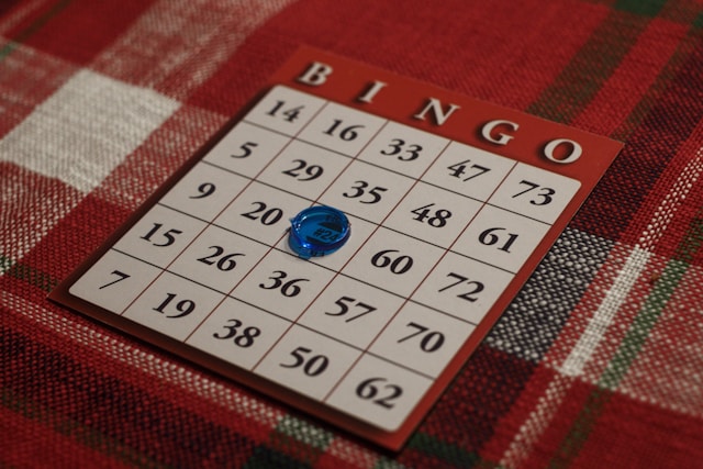 “Multiplication bingo game card on a red tablecloth—demonstrating fun, game-based learning strategies for teaching times tables effectively at James An College Eastwood.”