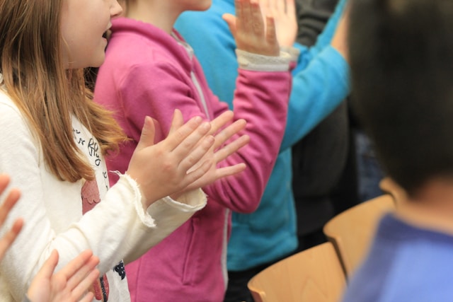 “Children clapping along in a classroom setting—reinforcing multiplication learning through rhythm and movement at James An College Eastwood.”