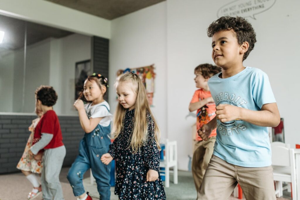“Group of students clapping and dancing to times tables, using music and movement to master multiplication.”